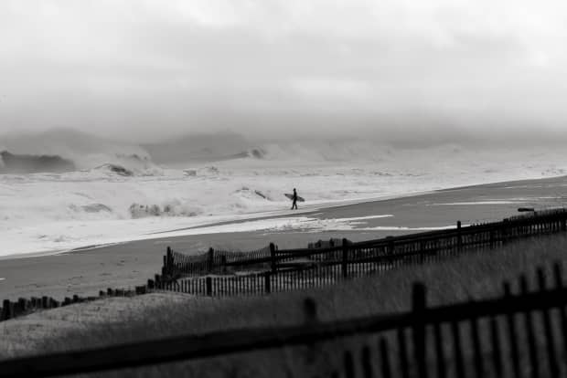 Ryan Huckabee clocks another lap up the beach for more; definitely a strong day for the current. It wasn’t a rare sight to see guys get denied and swept up the beach.<p>Pat Nolan</p>