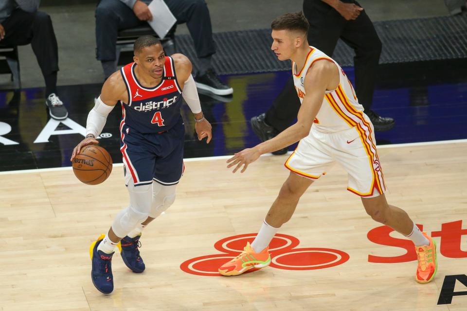 Washington Wizards guard Russell Westbrook looks to drive past by Atlanta Hawks guard Bogdan Bogdanovic (13) during a May 10 game.