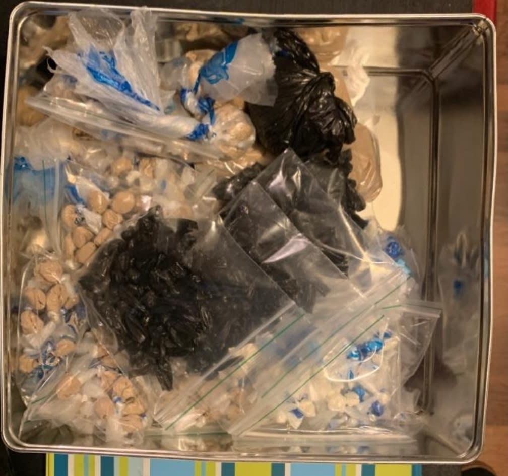 A tin was discovered in a bedroom wardrobe that contained wraps of heroine to the estimated value of £43,000, as well as white rocks that tested positive as crack cocaine (GMP)