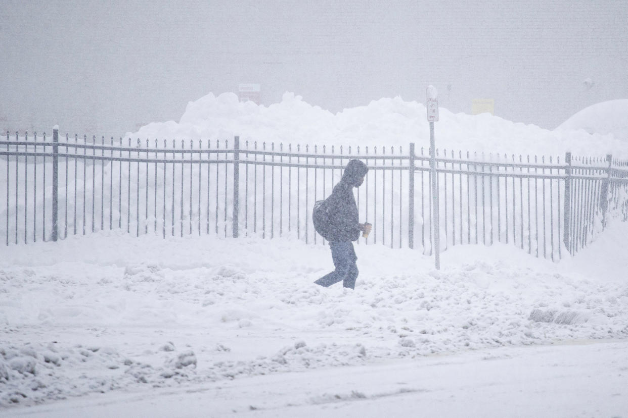 A person walks through the snow in Buffalo, N.Y. (Joshua Bessex / AP)