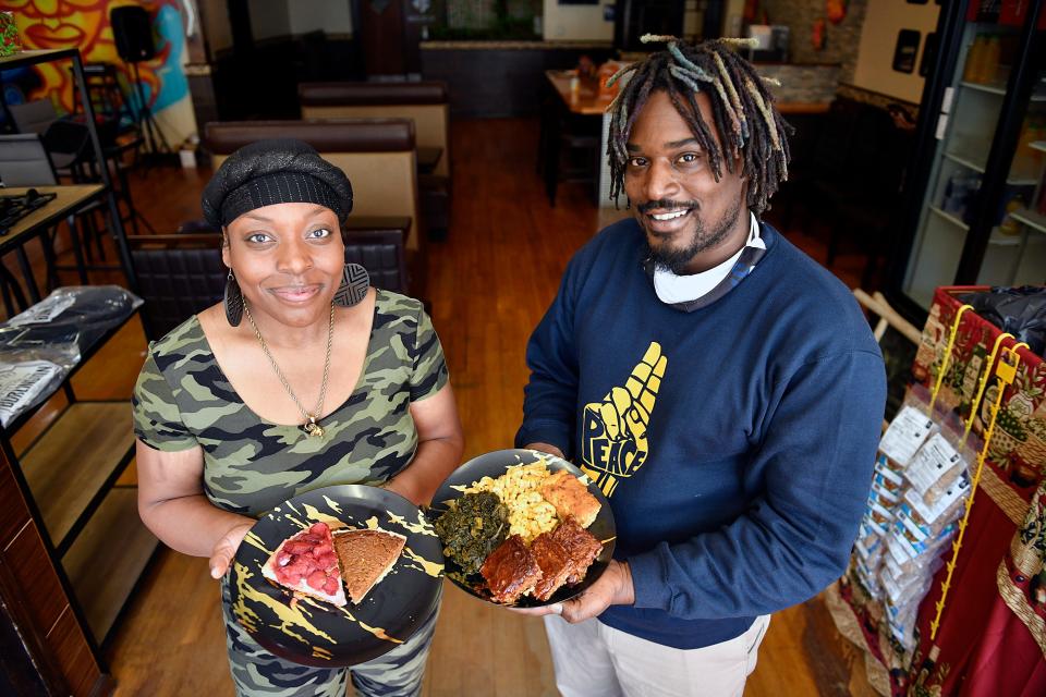 Co-owners of La Lus Vegan Cafe, Shawnna Hardin and Jermel Vaughan, hold some of the Thanksgiving menu items such as the Cheesy La Lus Meatloaf entree in Beverly in this Courier Post file photo.