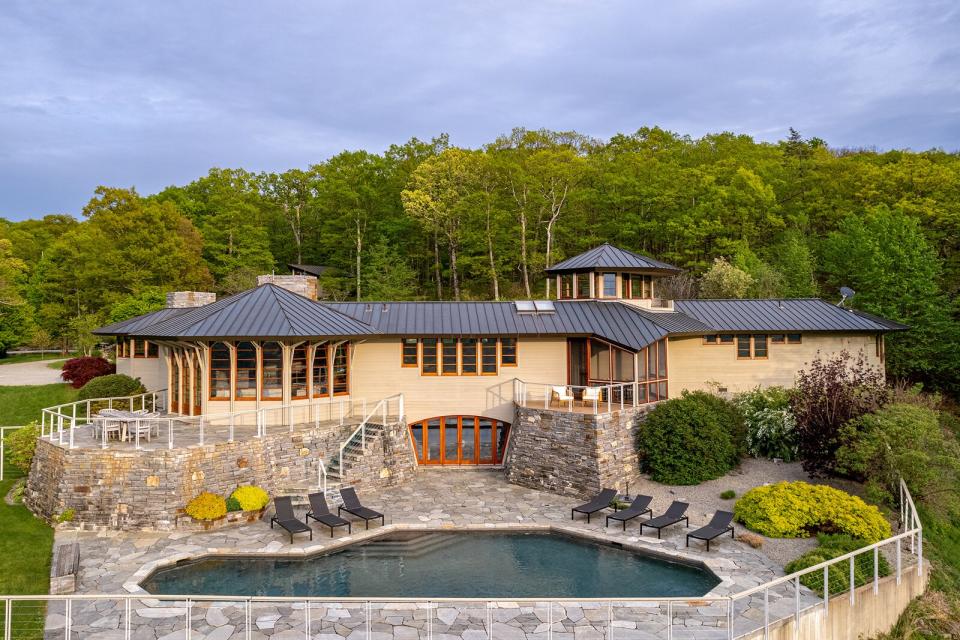 Crafted from cedar, glass, and stone, this 3,625-square-foot residence sits on nearly 32 acres with access to the Appalachian trail.