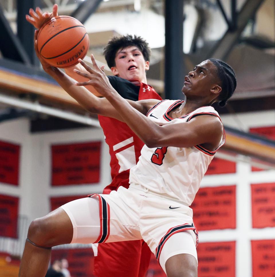 Brockton's Nathan Rateau has his shot blocked by Bridgewater-Raynham defender Cameron Santos during a game on Thursday, Jan. 12, 2024.