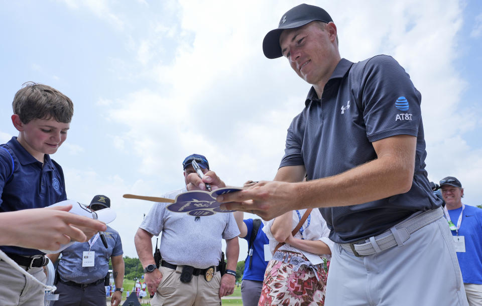Jordan Spieth signs autographs after playing the first round of the Byron Nelson golf tournament in McKinney, Texas, Thursday, May 2, 2024. (AP Photo/LM Otero)