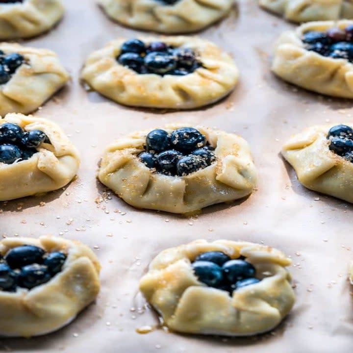 Mini blueberry galettes ready for the oven.