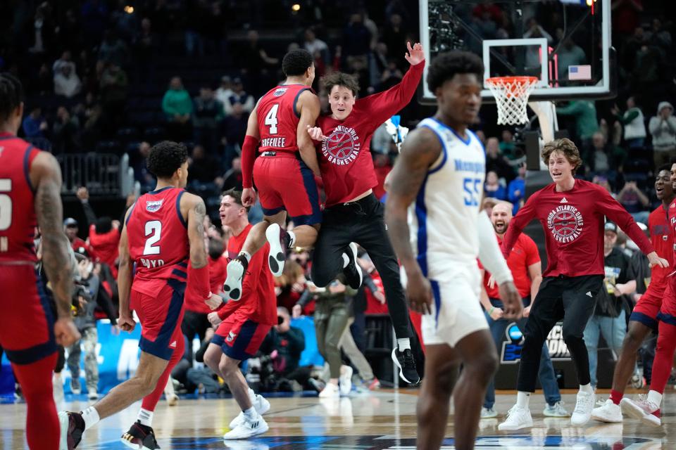 Florida Atlantic players celebrate their 66-65 win against the Memphis Tigers after a first-round college basketball game in the NCAA Tournament Friday, March 17, 2023, in Columbus, Ohio. (AP Photo/Paul Sancya)