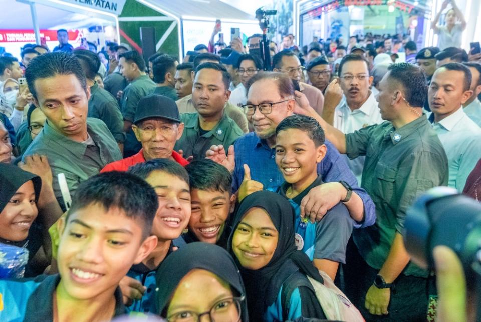 Prime Minister Datuk Seri Anwar Ibrahim mingles with guests at the Madani Government One Year Anniversary Programme in Bukit Jalil December 9, 2023. ― Picture by Shafwan Zaidon