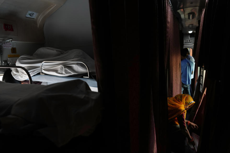 Passengers travel in an air-conditioned sleeper compartment of the Thirukkural Express Saturday, April 20, 2024. (AP Photo/Manish Swarup)