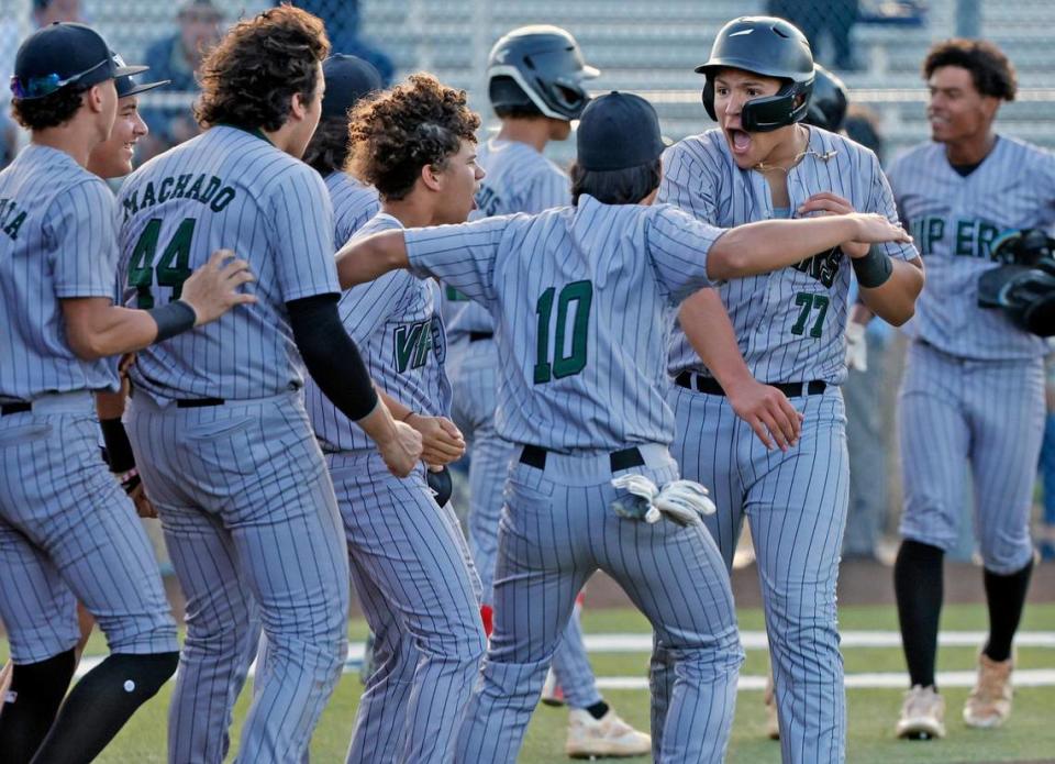 Varela Varsity Vipers Simon Molina (77) celebrates his home run hit against the Columbus Explorers in the second inning during the GMAC baseball championship game at Christopher Columbus High School in Miami, Fl on Thursday, April 20, 2023.