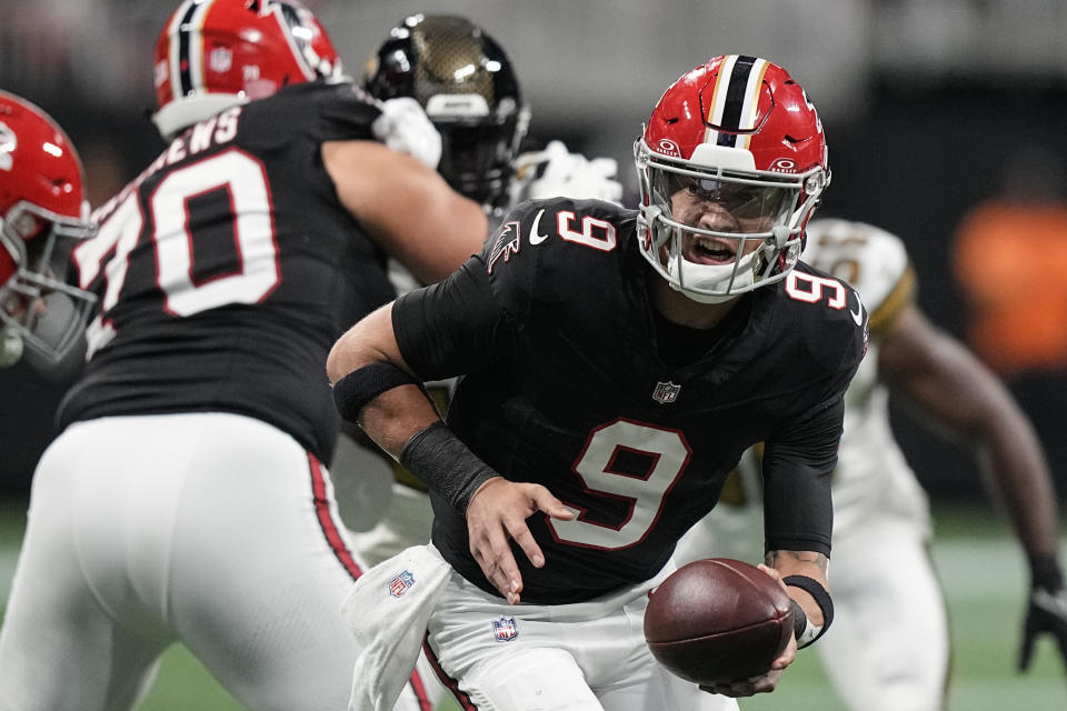 Atlanta Falcons quarterback Desmond Ridder (9) looks to hand the ball off during the first half of an NFL football game against the New Orleans Saints, Sunday, Nov. 26, 2023, in Atlanta. (AP Photo/Brynn Anderson)