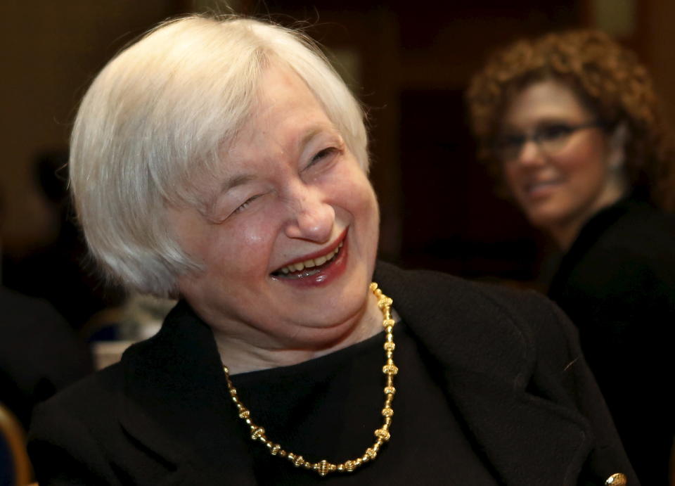 Federal Reserve Chair Janet Yellen smiles at the Federal Reserve's ninth biennial Community Development Research Conference focusing on economic mobility in Washington April 2, 2015. More research is needed to understand what policies allow people to move up the economic ladder and what holds them back, Yellen said on Thursday, returning to a controversial topic for the U.S. central bank. REUTERS/Yuri Gripas