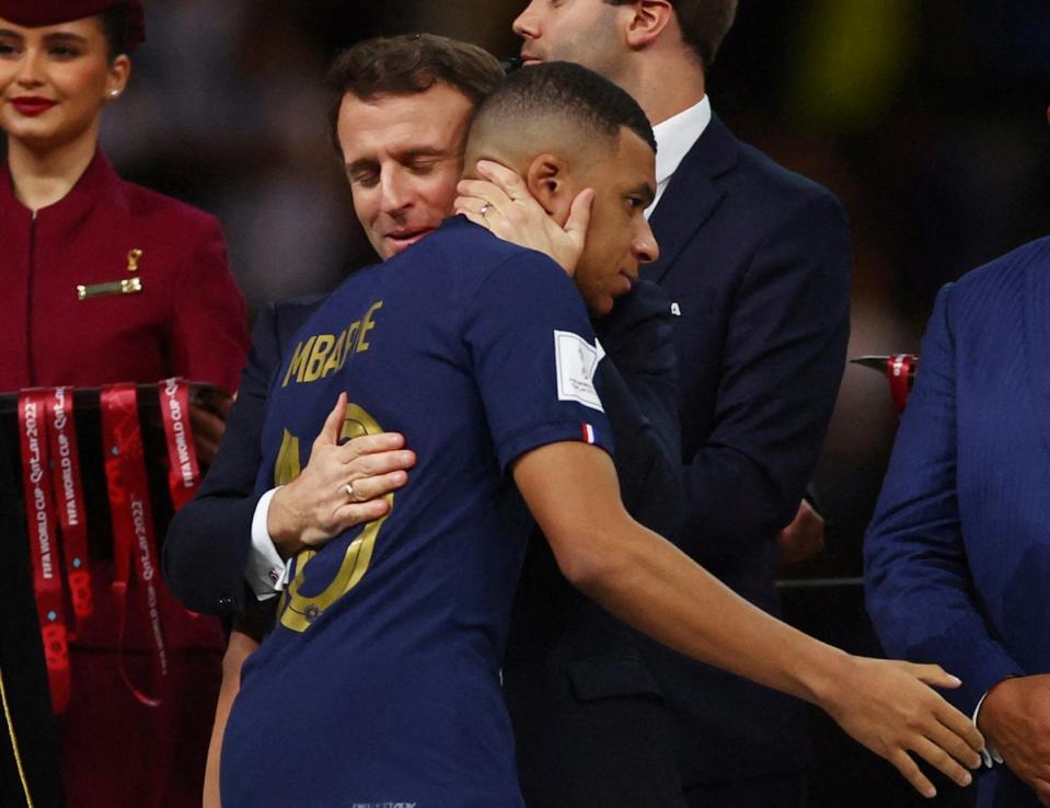 France’s Kylian Mbappe with French President Emmanuel Macron during the trophy ceremony (REUTERS)