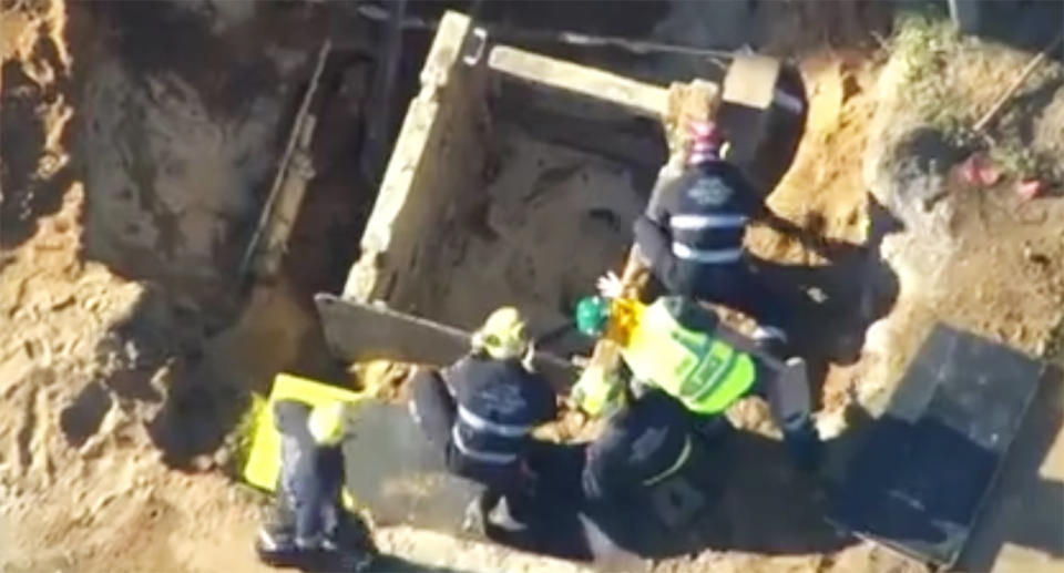 The construction worker fell about three metres into the trench that was filled with dirt and water on Wednesday afternoon. Image: 7 News