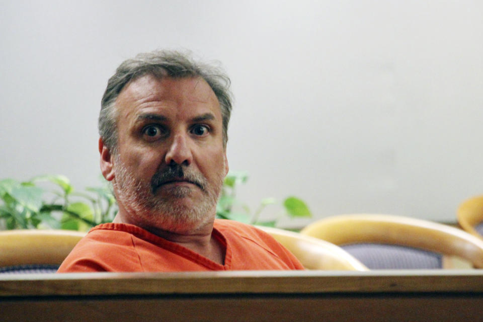 Brian Steven Smith sits in a courtroom while waiting for his arraignment to start in Anchorage, Alaska. 