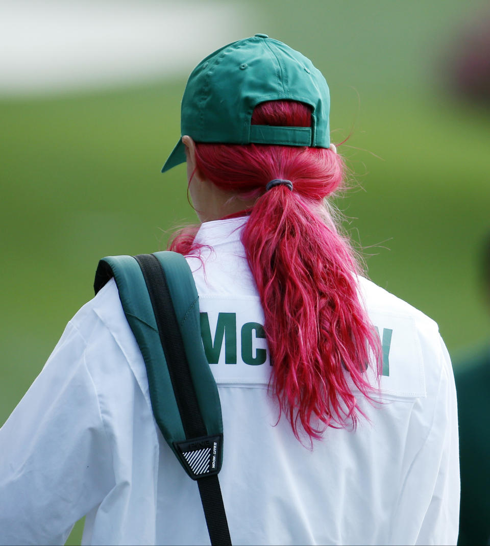 Tennis player Caroline Wozniacki waits for her fiancee Rory McIlroy, of Northern Ireland, during the par three competition at the Masters golf tournament Wednesday, April 9, 2014, in Augusta, Ga. (AP Photo/Matt Slocum)