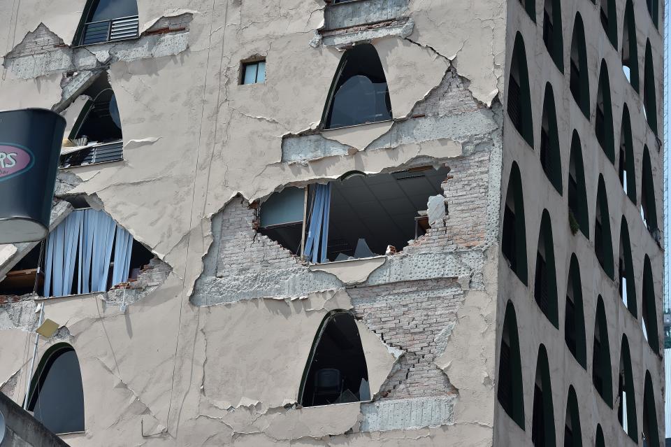 Exterior walls on a building crumbled during the earthquake.