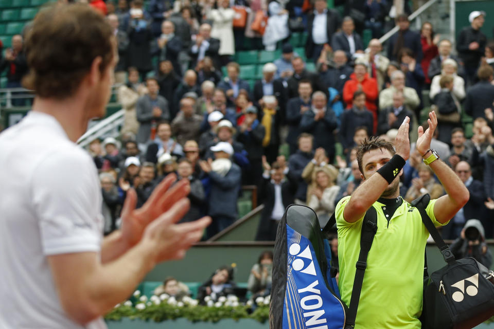 FILE - Britain's Andy Murray, left, applauds for Switzerland's Stan Wawrinka, right, after Murray won the semifinal match of the French Open tennis tournament in four sets, 6-4, 6-2, 4-6, 6-2, at the Roland Garros stadium in Paris, France, Friday, June 3, 2016. (AP Photo/Alastair Grant, File)