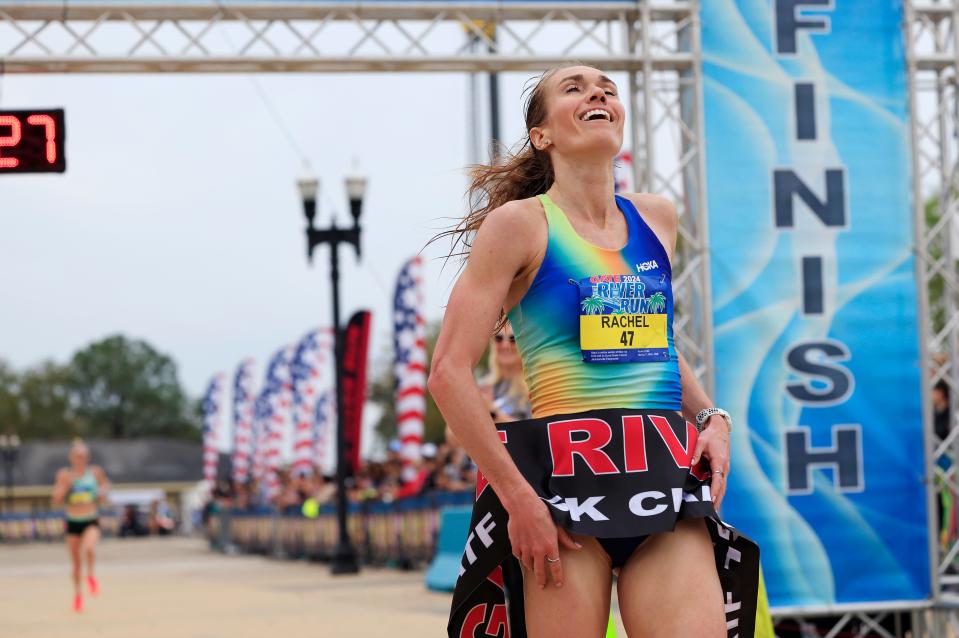 Rachel Smith (47) breaks the tape as she crosses the finish line ahead of Keira D'amato during the annual Gate River Run Saturday, March 2, 2024 outside EverBank Stadium in Jacksonville, Fla. Teshome Asfaha Mekonen won for the men in 42:51 and Smith for the women in 48:26.