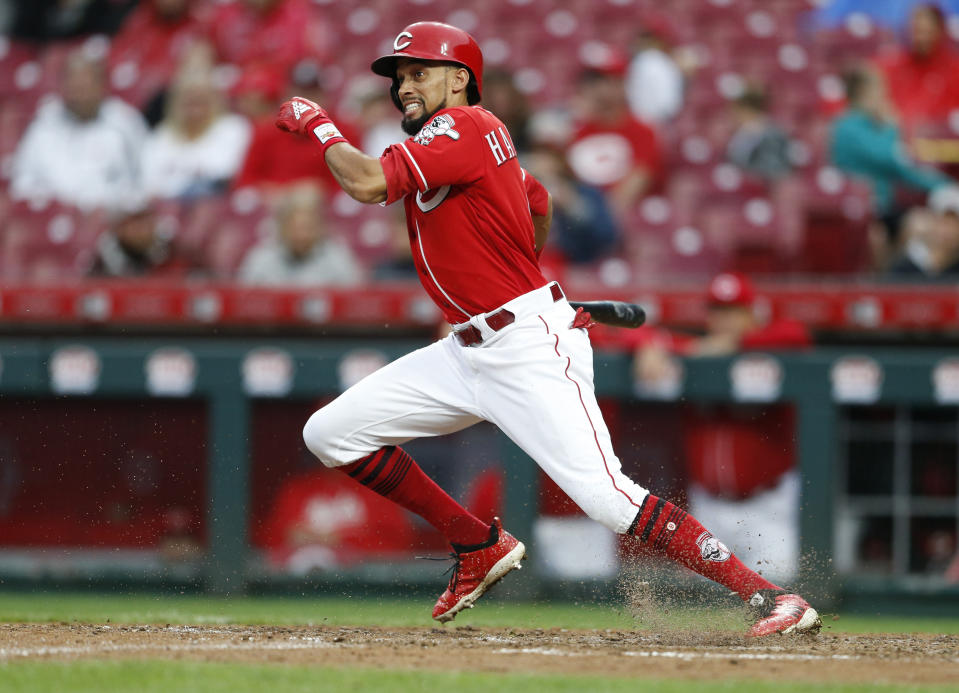 FILE - In this Sept. 9, 2018, file photo, Cincinnati Reds' Billy Hamilton takes off for first base with a single off San Diego Padres relief pitcher Rowan Wick during the seventh inning of a baseball game, in Cincinnati. A person familiar with the negotiations says the Kansas City Royals and outfielder Billy Hamilton have agreed to a $5.25 million contract for next season that includes up to $1 million in incentives. The person spoke to The Associated Press on condition of anonymity Monday, Dec. 10, 2018, because the deal was pending a physical. The career .236 hitter's biggest attribute is his speed — he stole at least 50 bases four straight seasons before dipping to 34 last season. (AP Photo/Gary Landers, File)