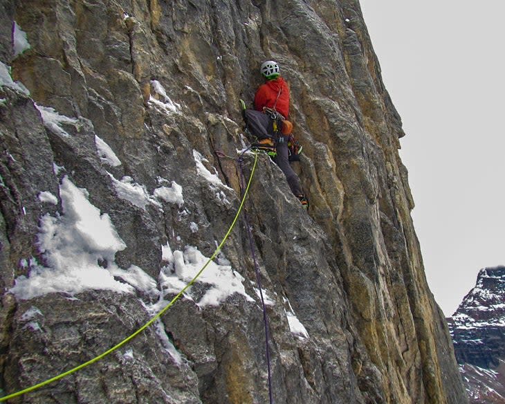 <span class="article__caption">Ian Welsted climbs steep ground on the then-unclimbed north face of Mt. Tuzo (10,650 feet). He was satisfied with the climb despite failing to complete the route.</span> (Photo: Jay Mills)