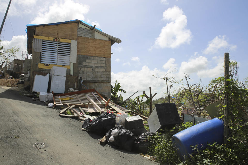 Debris gathers on the streets in Can&oacute;vanas, Puerto Rico on Oct. 14, 2017. (Photo: Carolina Moreno/HuffPost)