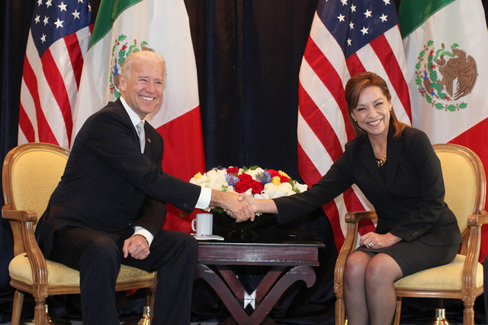 U.S. Vice President Joe Biden, left, and Josefina Vazquez Mota, presidential candidate for the National Action Party, PAN, shake hands as they pose for pictures in Mexico City, Monday, March 5, 2012. Biden is on a one-day official visit to Mexico. (AP Photo/Alexandre Meneghini)