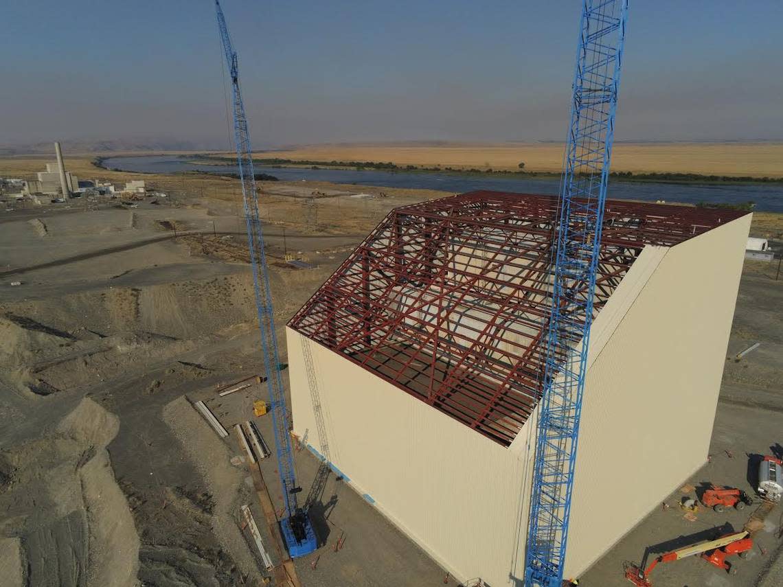 Progress on building a steel cocoon to enclose the Hanford K East Reactor is shown.