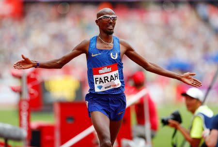 Britain Athletics - 2016 London Anniversary Games - Queen Elizabeth Olympic Park, Stratford, London - 23/7/16 Great Britain's Mo Farah celebrates winning the men's 5000m Reuters / Eddie Keogh Livepic