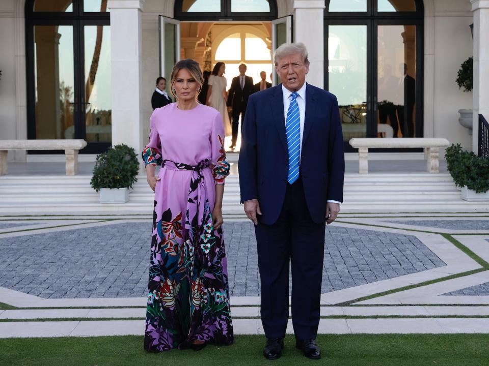 melania and donald trump standing next to each other outside a fundraiser in palm beach