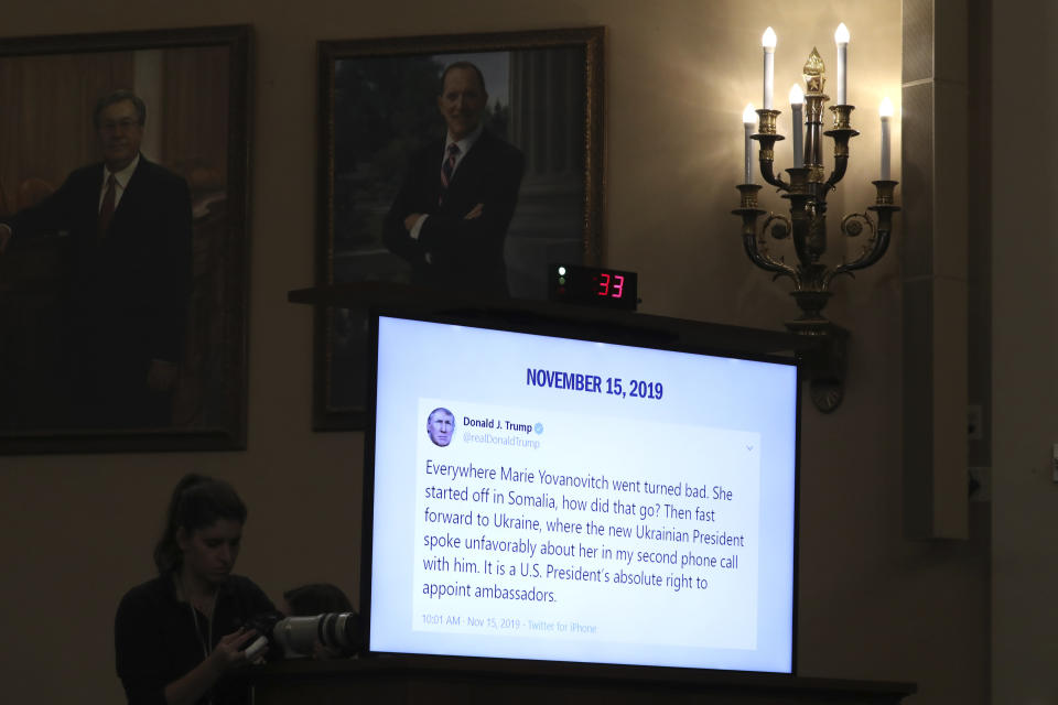 FILE - In this Nov. 15, 2019, file photo, a tweet from President Donald Trump is displayed on a monitor as former U.S. Ambassador to Ukraine Marie Yovanovitch testifies before the House Intelligence Committee on Capitol Hill in Washington, during the second public impeachment hearing of President Donald Trump's efforts to tie U.S. aid for Ukraine to investigations of his political opponents. (AP Photo/Andrew Harnik, File)