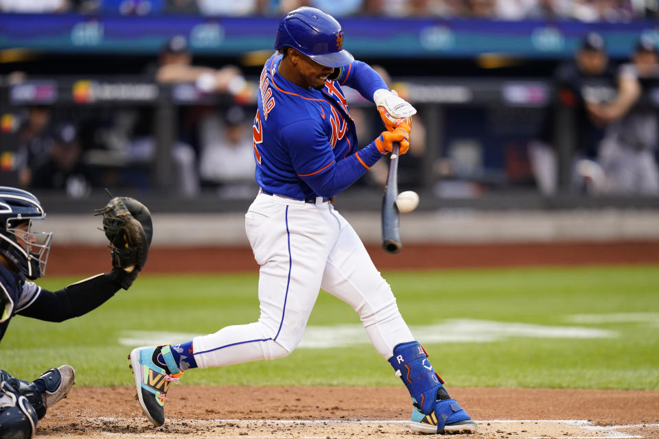 New York Mets' Francisco Lindor hits a double during the first inning of a baseball game against the New York Yankees Tuesday, July 26, 2022, in New York. (AP Photo/Frank Franklin II)