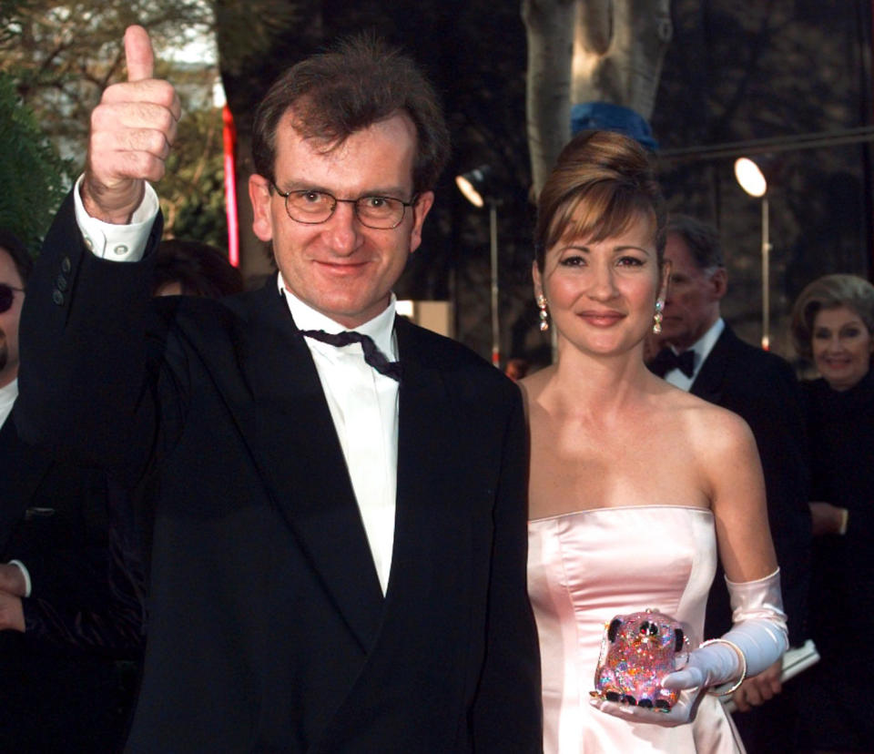 FILE - In this March 25, 1996 file photo, Director of &quot;Babe&quot; Chris Noonan, left, and the voice of &quot;Babe&quot; Christine Cavanaugh, right, arrive for the 68th Academy Awards at the Music Center in Los Angeles. Cavanaugh, 51, a prolific voice actress whose characters included the titular character of “Babe,” has died. Cavanaugh’s sister Deionn Masock confirmed Tuesday, Dec. 30, 2014, that Cavanaugh died December 22 at her home in Utah.   (AP Photo/Kevork Djansezian, File)