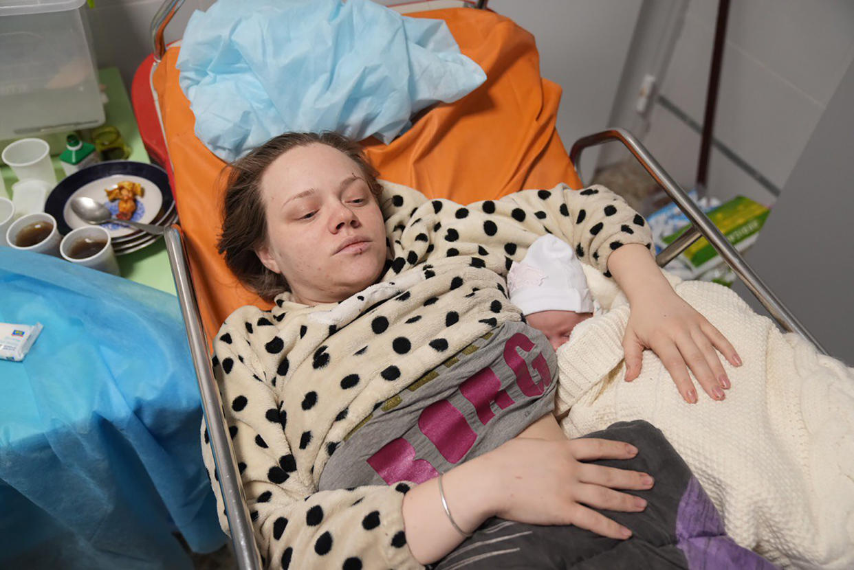 Mariana Vishegirskaya lies in a hospital bed after giving birth to her daughter Veronika in Mariupol, Ukraine, on Friday. (AP/Evgeniy Maloletka)
