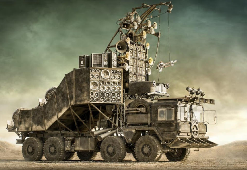 An image of a modified truck, the Doof Wagon, in the desert