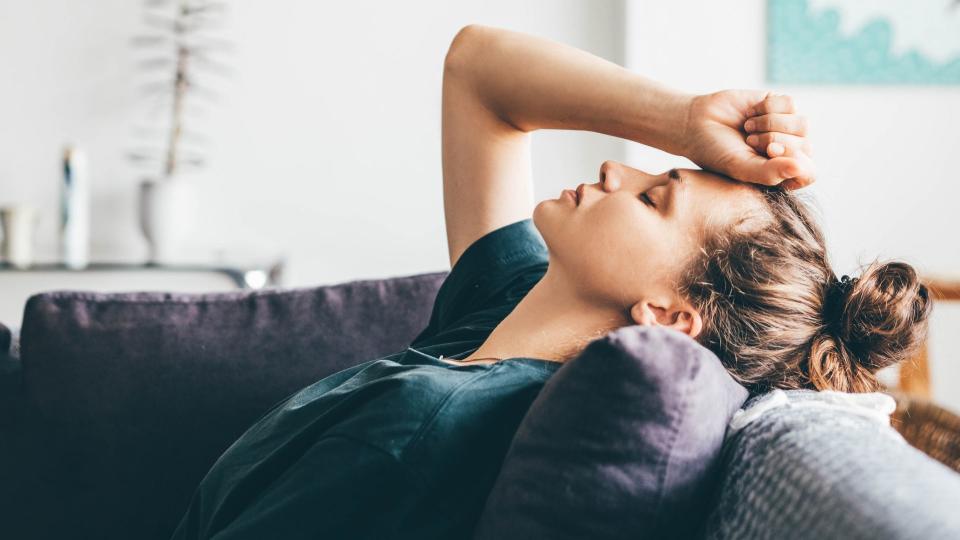 Woman leaning back on the sofa