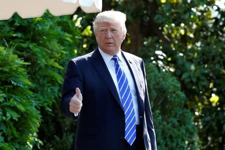 U.S. President Donald Trump gestures as he walks on the South Lawn of the White House in Washington, DC, U.S., before his departure to Groton, Connecticut, May 17, 2017. REUTERS/Yuri Gripas