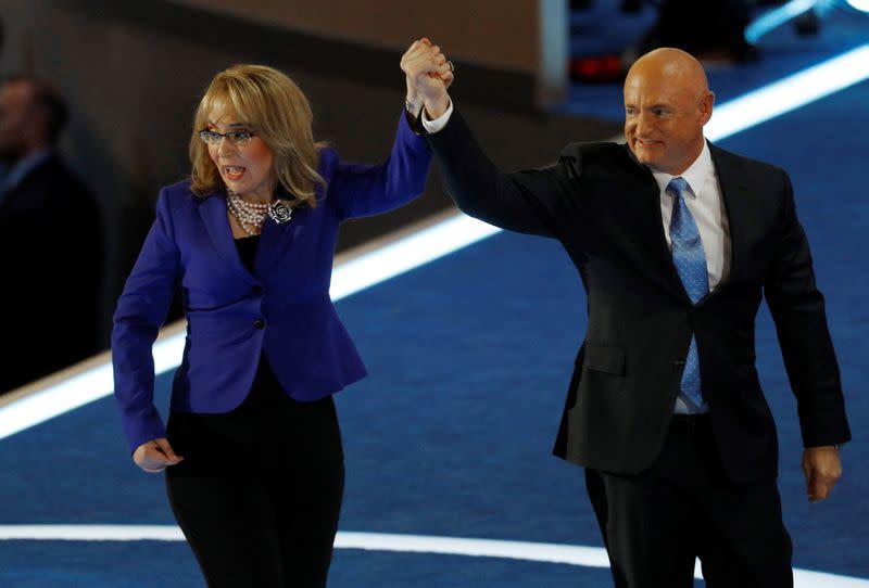 FILE PHOTO: Former Rep. Gabby Giffords and her husband Mark Kelly wave after addressing the Democratic National Convention in Philadelphia
