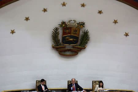 Julio Borges (C), President of the National Assembly, first Vice President of the chamber Freddy Guevara (L), and second Vice President of the chamber Dennis Fernandez, deputies of the Venezuelan coalition of opposition parties (MUD), attend a session of the National Assembly in Caracas, Venezuela April 5, 2017. REUTERS/Marco Bello