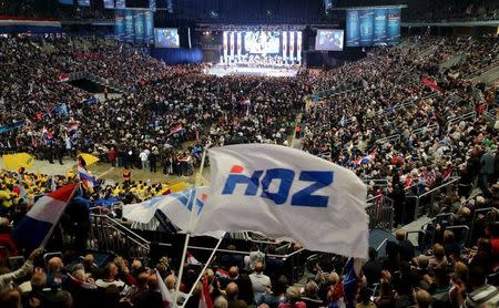 Supporters of Croatian Democratic Union (HDZ) wave HDZ flags during an election rally at Arena in Zagreb, Croatia, November 5, 2015. REUTERS/Antonio Bronic