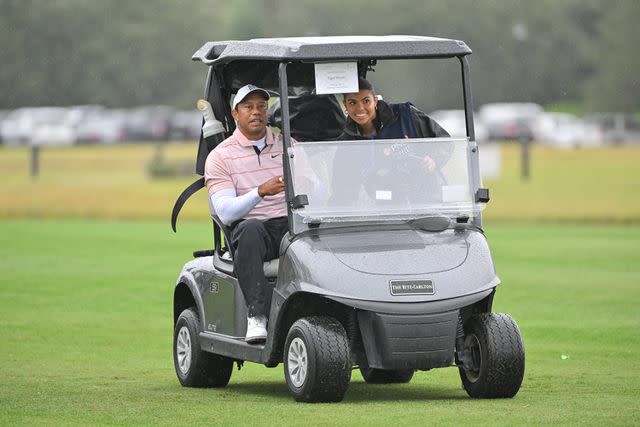 <p>Ben Jared/PGA TOUR via Getty</p> Tiger Woods and Sam Woods ride in a golf cart on Dec. 16