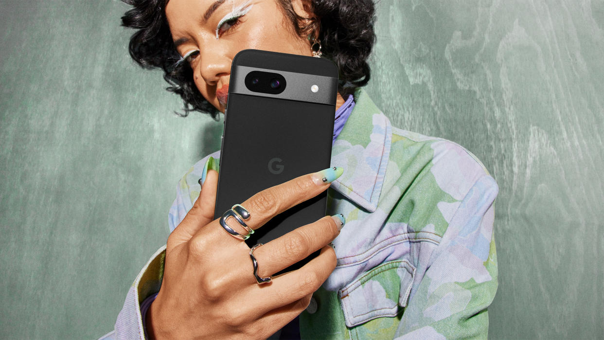  A person holding an Obsidian Google Pixel 8a. 