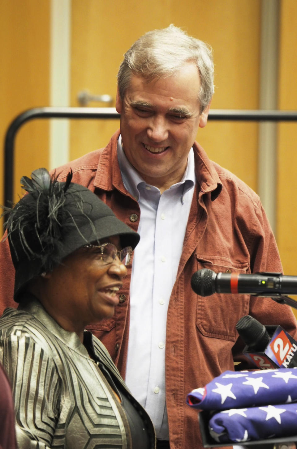 In this Monday, Jan. 21, 2019 photo provided by Zoe Selsky, U.S. Sen. Jeff Merkley listens to Gwen Carr with the Oregon Black Pioneers. during a town hall at Chemeketa Community College in Salem. Ore. On a day when another U.S. senator formally entered the 2020 presidential race, Merkley, who's also pondering a run, seemed content to just be a senator by holding a town hall back in his home state of Oregon. (Zoe Selsky via AP)