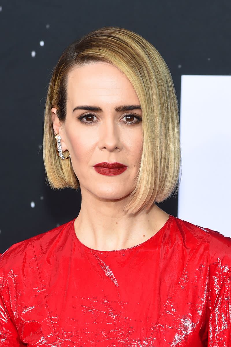 <p> The uniformity of Paulson&apos;s sleek, salt and pepper blonde bob is what makes it look so timeless. You can do the same by slightly curling your ends under with a hair straightener and tucking one side behind the ear. </p>
