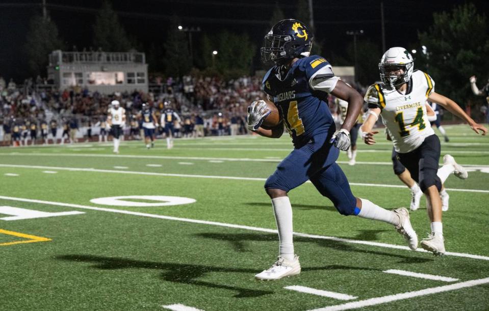 Gregori’s Reggieon Foster runs for a touchdown after a catch during the game with Livermore at Gregori High School in Modesto, Calif., Friday, September 8, 2023.
