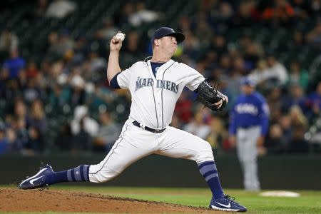 Sep 21, 2017; Seattle, WA, USA; Seattle Mariners relief pitcher Emilio Pagan (54) throws against the Texas Rangers during the seventh inning at Safeco Field. Mandatory Credit: Joe Nicholson-USA TODAY Sports