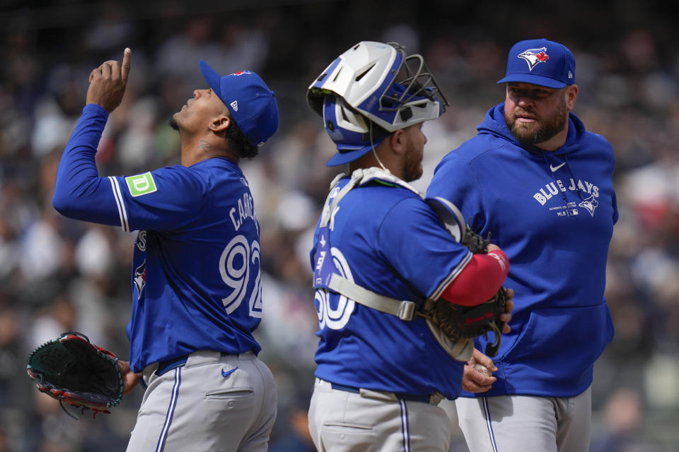 Toronto Blue Jays pitcher Génesis Cabrera, left, reacts as he is pulled from the game by manager John Schneider, right, during the seventh inning of the baseball game against the New York Yankees at Yankee Stadium Friday, April 5, 2024, in New York. (AP Photo/Seth Wenig)