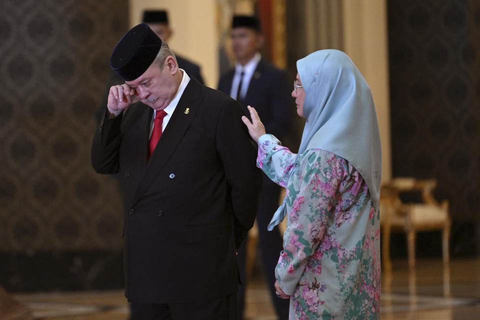 Sultan Ibrahim Iskandar of Johor, left, wipes his tears next to his sister Malaysia's Queen Tunku Azizah Aminah Maimunah Iskandariah after the election for the next Malaysian king at the National Palace in Kuala Lumpur Friday, Oct. 27, 2023. Malaysia's royal families have elected the powerful and wealthy ruler of southern Johor state as the country's new king under a unique rotating monarchy system, the palace said Friday. Sultan Ibrahim Iskandar, 64, will ascend to the throne on Jan. 31 for a five-year term. the palace said in a statement(Mohd Rasfan/Pool Photo via AP)