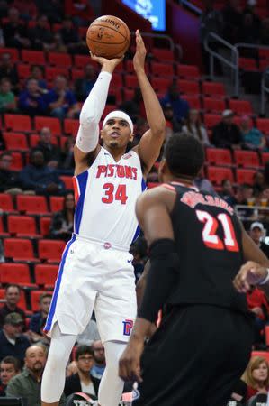 Nov 12, 2017; Detroit, MI, USA; Detroit Pistons forward Tobias Harris (34) shoots over Miami Heat center Hassan Whiteside (21) during the first quarter at Little Caesars Arena. Tim Fuller-USA TODAY Sports