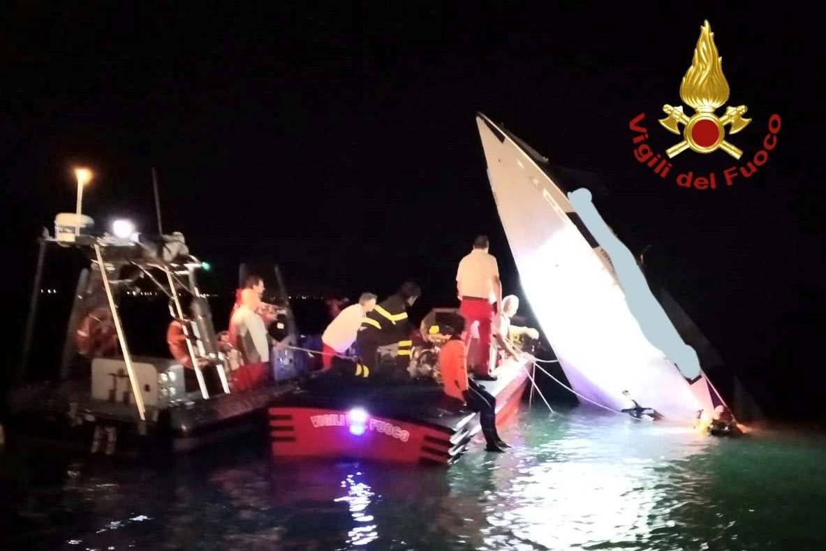 Rescue workers surround the remains of a speed boat which crashed in Venice: via REUTERS