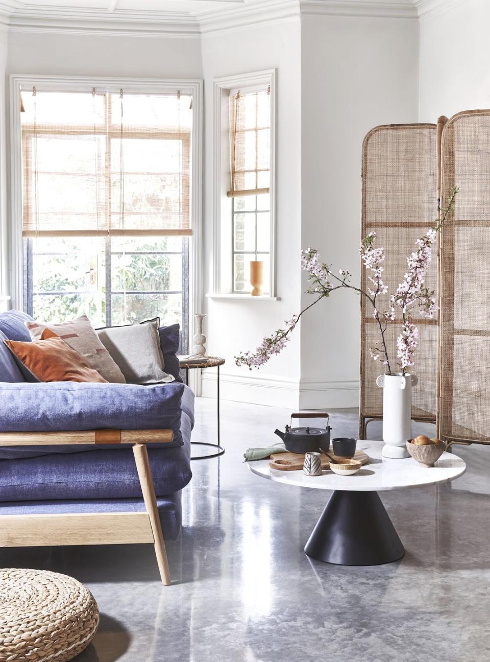 <p>On-trend materials like marble and polished concrete can feel quite cool, so balance them out with delicate, organic details such as bamboo blinds and rattan furniture.</p>
